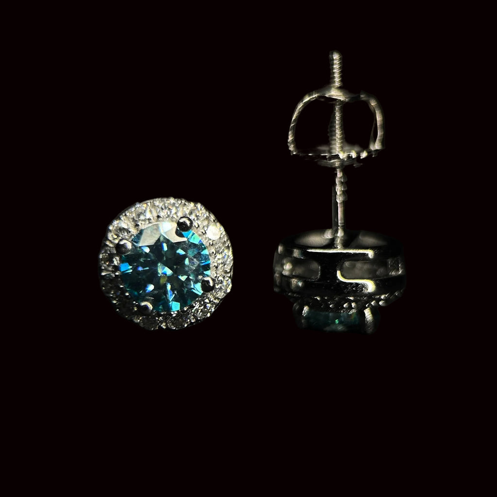 Silver earrings with gemstones on a black background