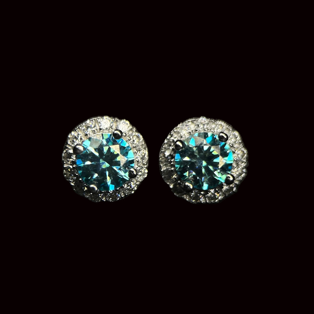 Pair of round stud earrings with gemstones on a black background