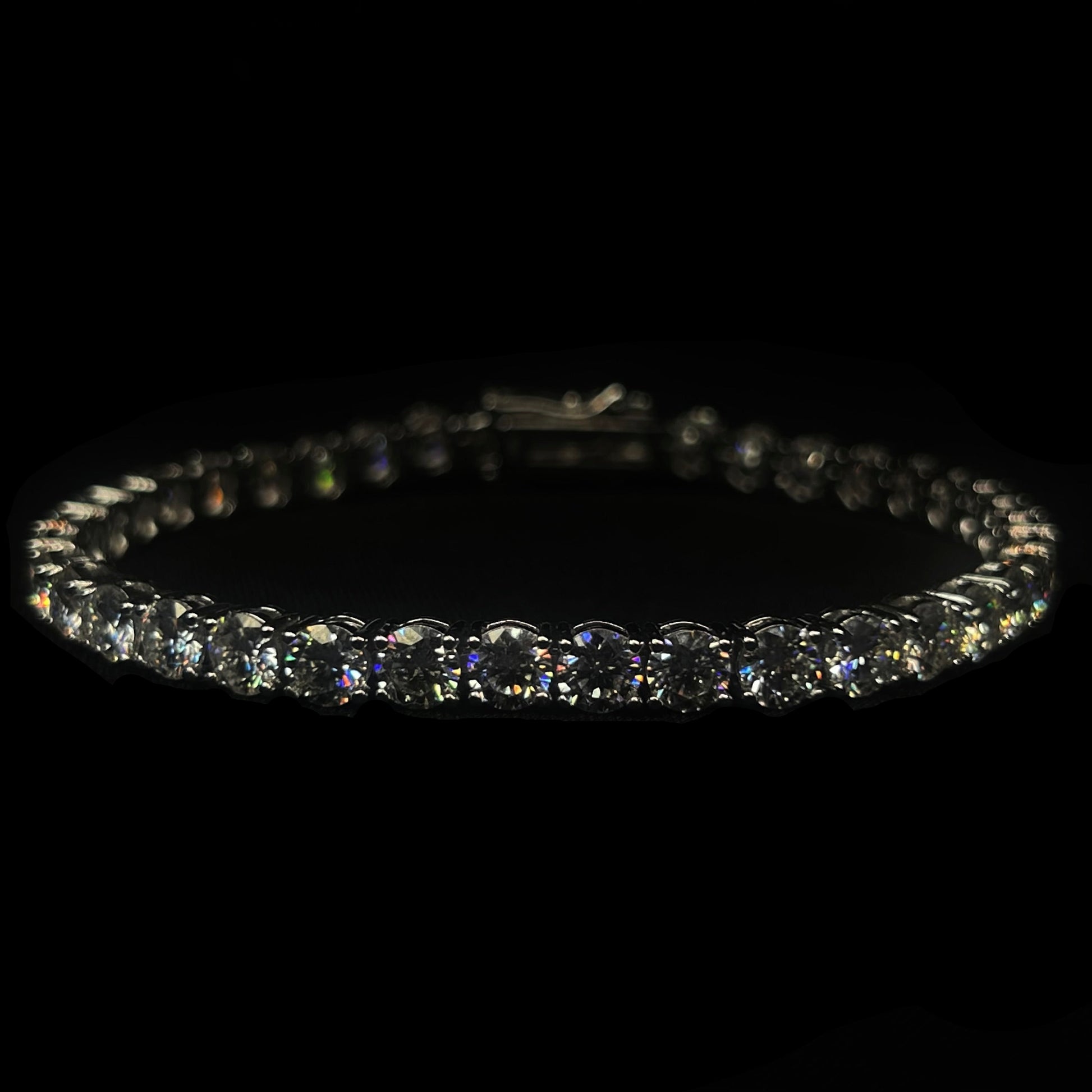 Diamond bracelet on a black background with 'CRUDDA.' branding.
