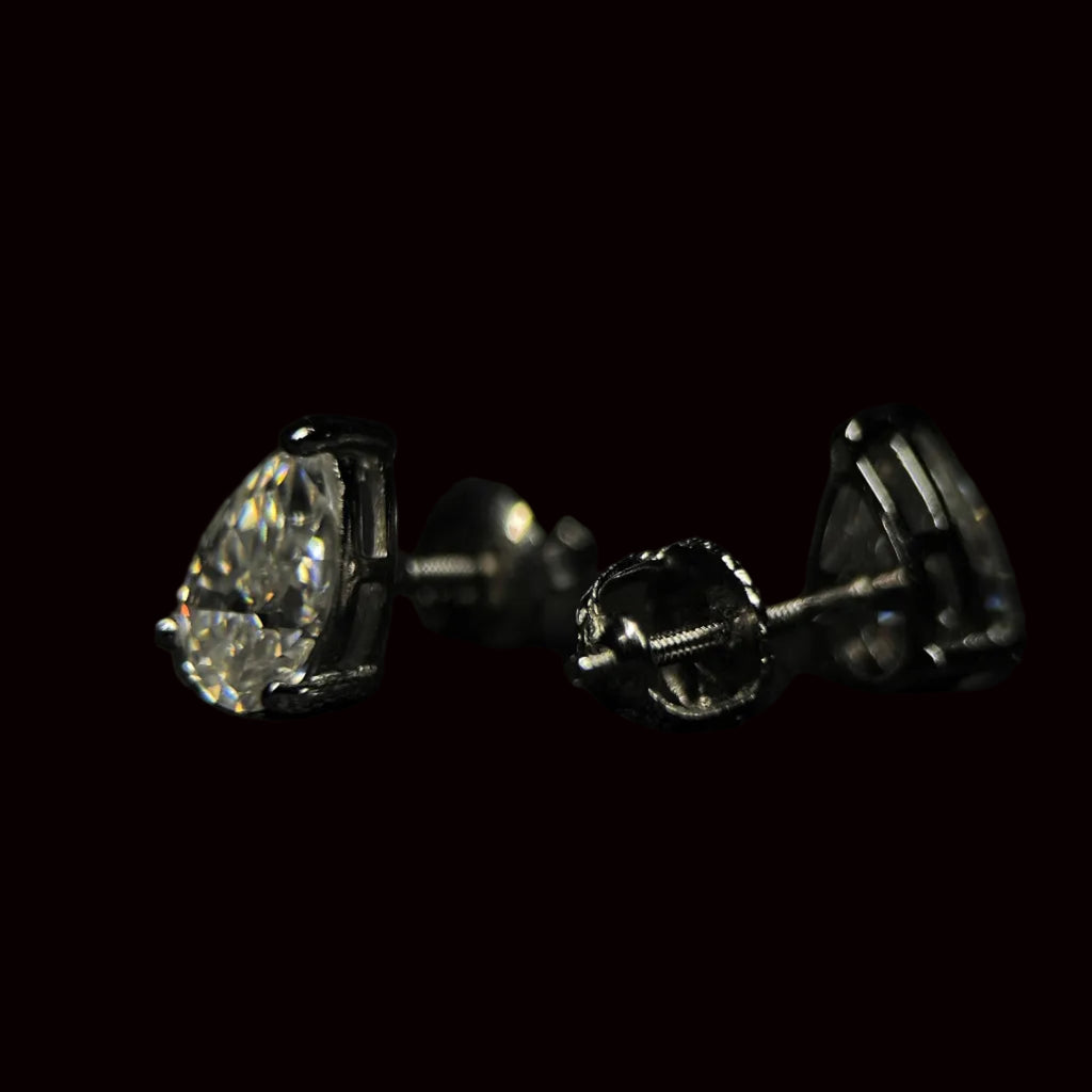 Diamond stud earrings on a black background